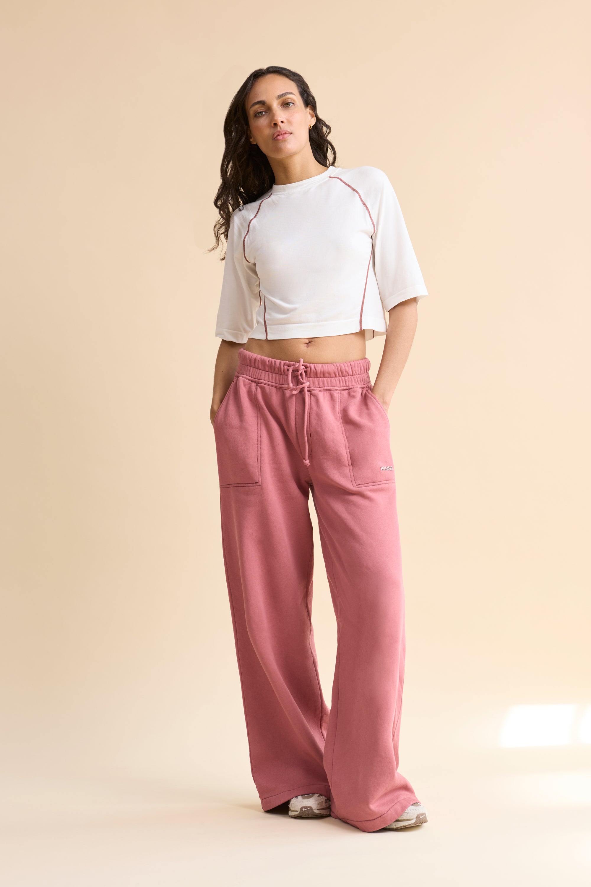 HRMN8 Women's white pink Reform Tee, seamless ultra-soft nylon with contrast stitching and sculpted athleisure fit.