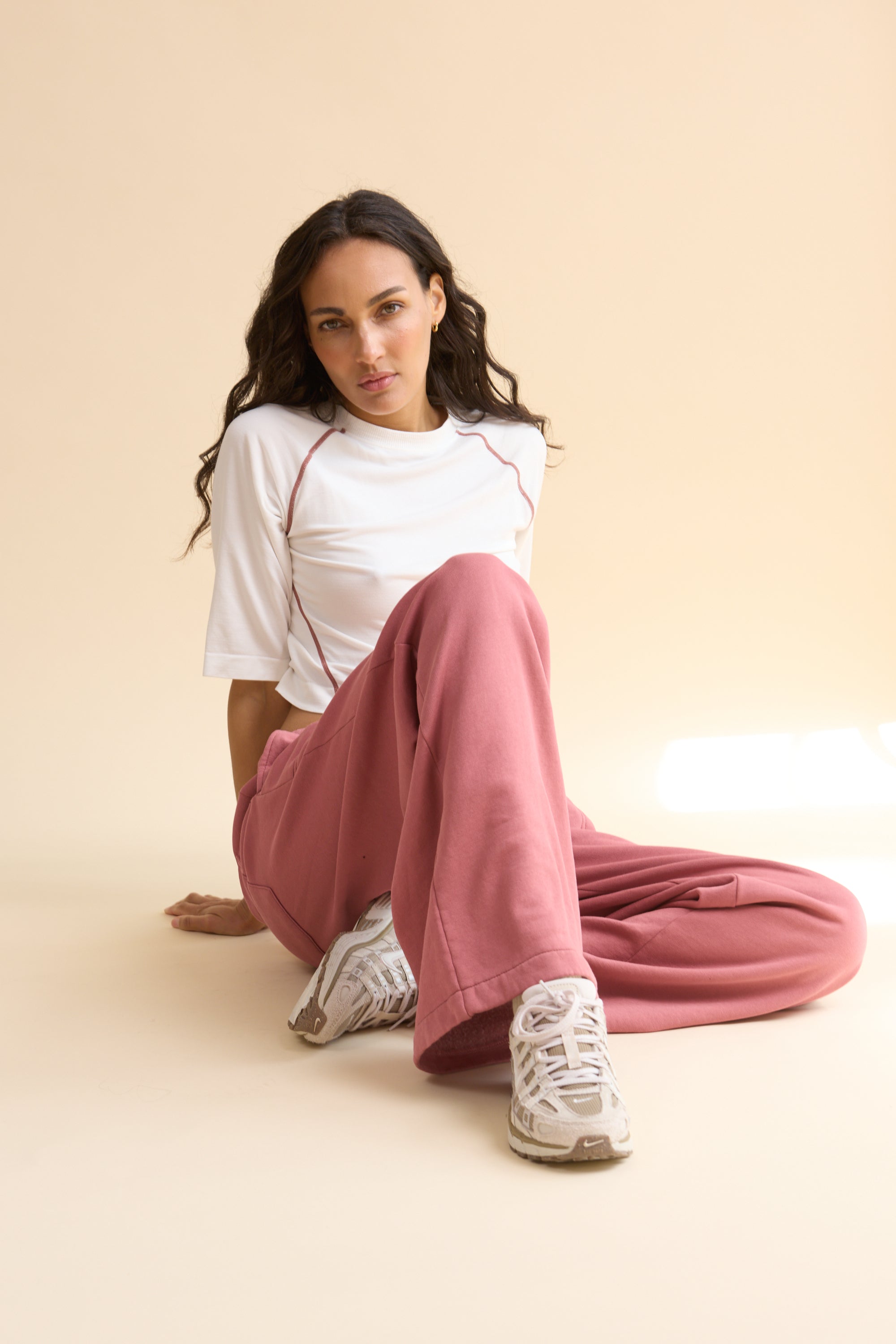 HRMN8 Women's white pink Reform Tee, seamless ultra-soft nylon with contrast stitching and sculpted athleisure fit.