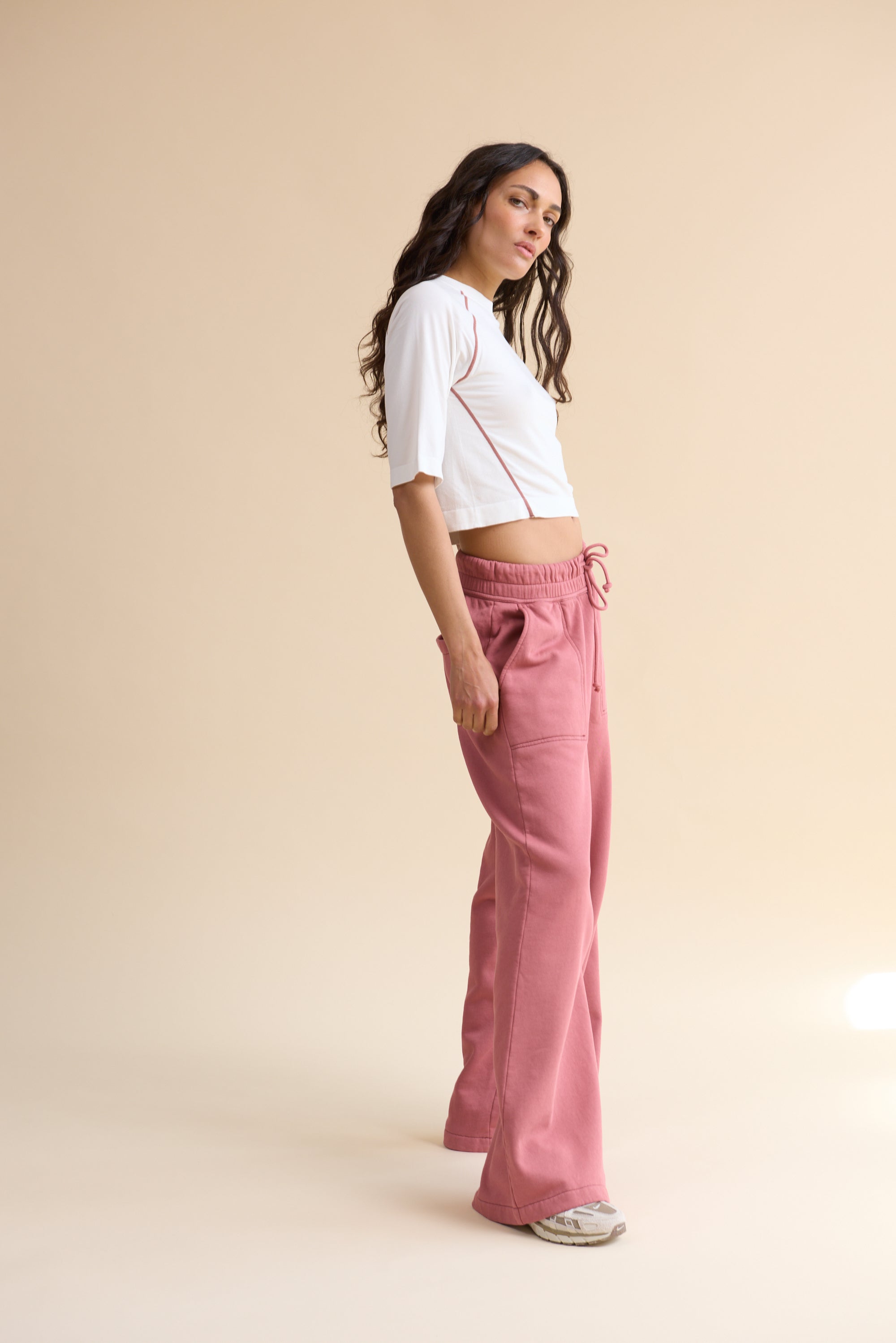 HRMN8 Women's white pink Reform Tee, seamless ultra-soft nylon with contrast stitching and sculpted athleisure fit.