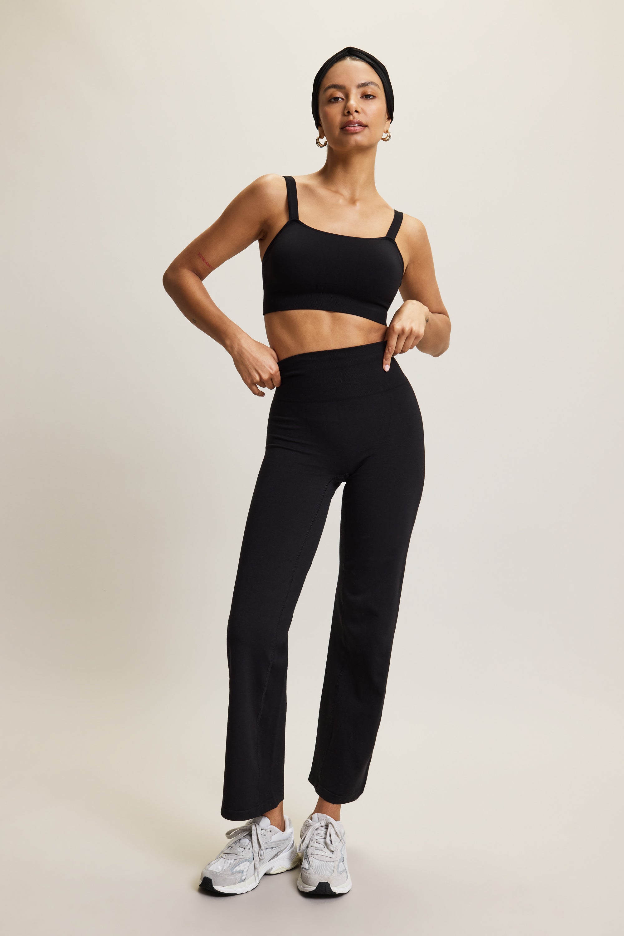 Premium wide leg bamboo black yoga trousers with a high-rise ribbed waistband in soft brown fabric, designed for yoga, Pilates, lounging, and versatile athleisure wear. These comfortable and breathable activewear pants offer a relaxed yet stylish fit, perfect for transitioning from studio to street or incorporating into an everyday wardrobe.
