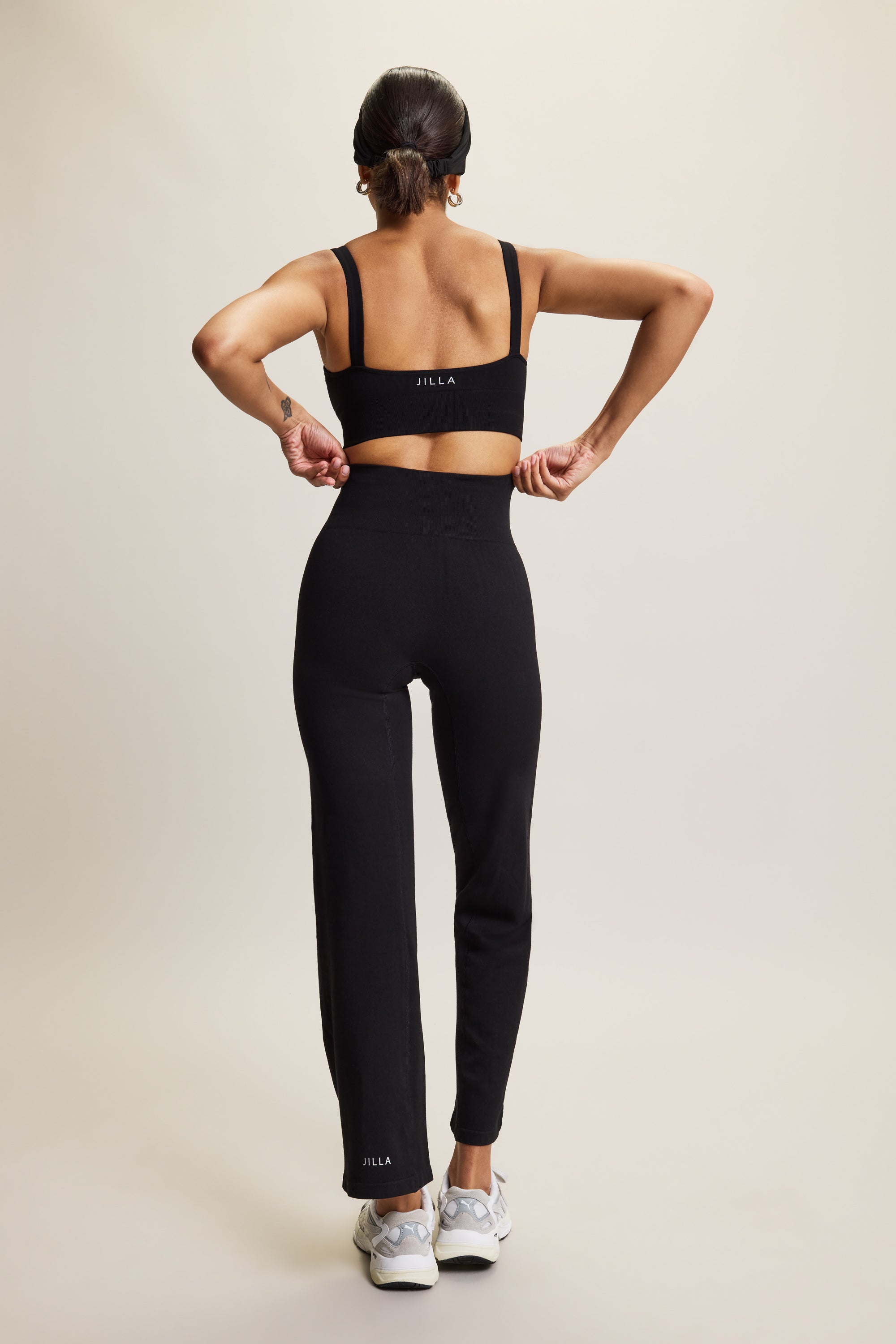 Black luxury premium bamboo bandeau seamless sports bra featuring a square neckline and removable pads, crafted from soft  fabric with a blend of bamboo viscose, polyamide, and elastane for a smooth, comfortable fit. Perfect for yoga, Pilates, lounging, and low-impact workouts, this elegant sports bra pairs beautifully with matching Ananda Bamboo Trousers for a chic athleisure look